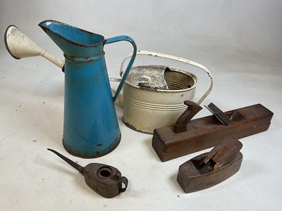 Lot 45 - A large blue enamelled jug, a metal watering...