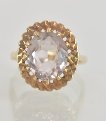 Lot 1346 - A 9ct gold dress ring with claw set clear...