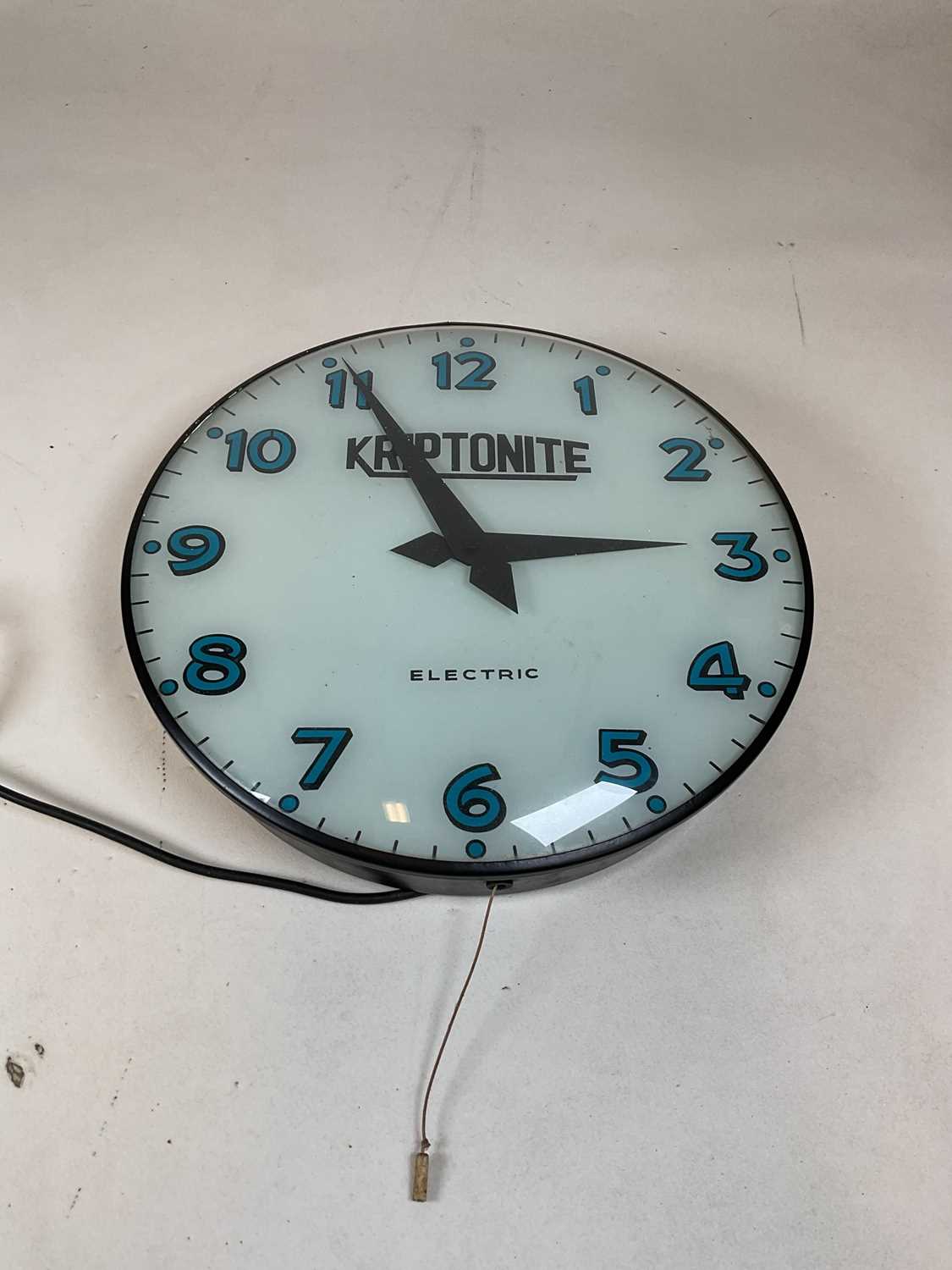 Lot 658 - A vintage electric wall clock inscribed...