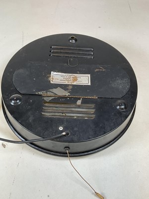 Lot 658 - A vintage electric wall clock inscribed...