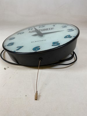 Lot 658 - A vintage electric wall clock inscribed...