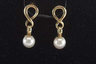 Lot 1458 - A pair of 9ct gold figure of eight link and...