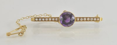 Lot 1488 - A 9ct gold bar brooch, with central bezel set...