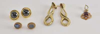 Lot 1447 - A 9ct gold pendant with claw set marquise cut...