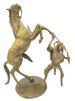 Lot 617 - A large modern heavy brass figure of a rider...