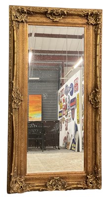 Lot 70 - A large modern ornately gilt framed...