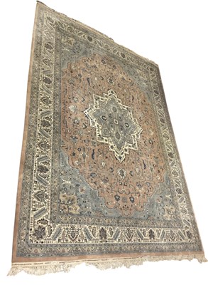 Lot 90 - A cream ground machine made carpet, decorated...