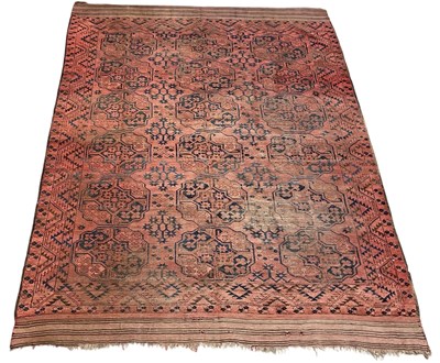 Lot 89 - A large antique red ground Turkmen carpet, 275...