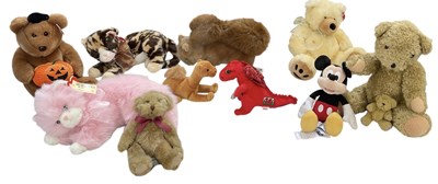 Lot 526 - A collection of eleven stuffed toys including...