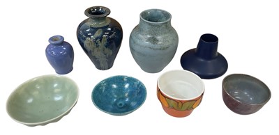 Lot 565 - A collection of eight pieces of art pottery...