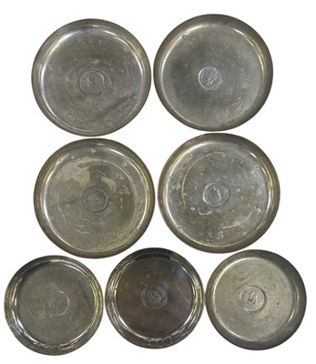 Lot 1689 - A set of four silver plated circular pin...