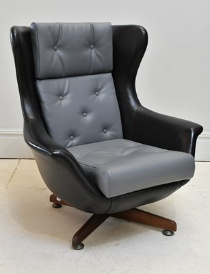Lot 11 - A Parker Knoll Statesman style swivel tilt...