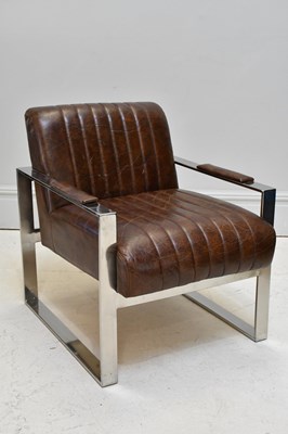 Lot 12 - A mid century leather and chrome elbow chair,...