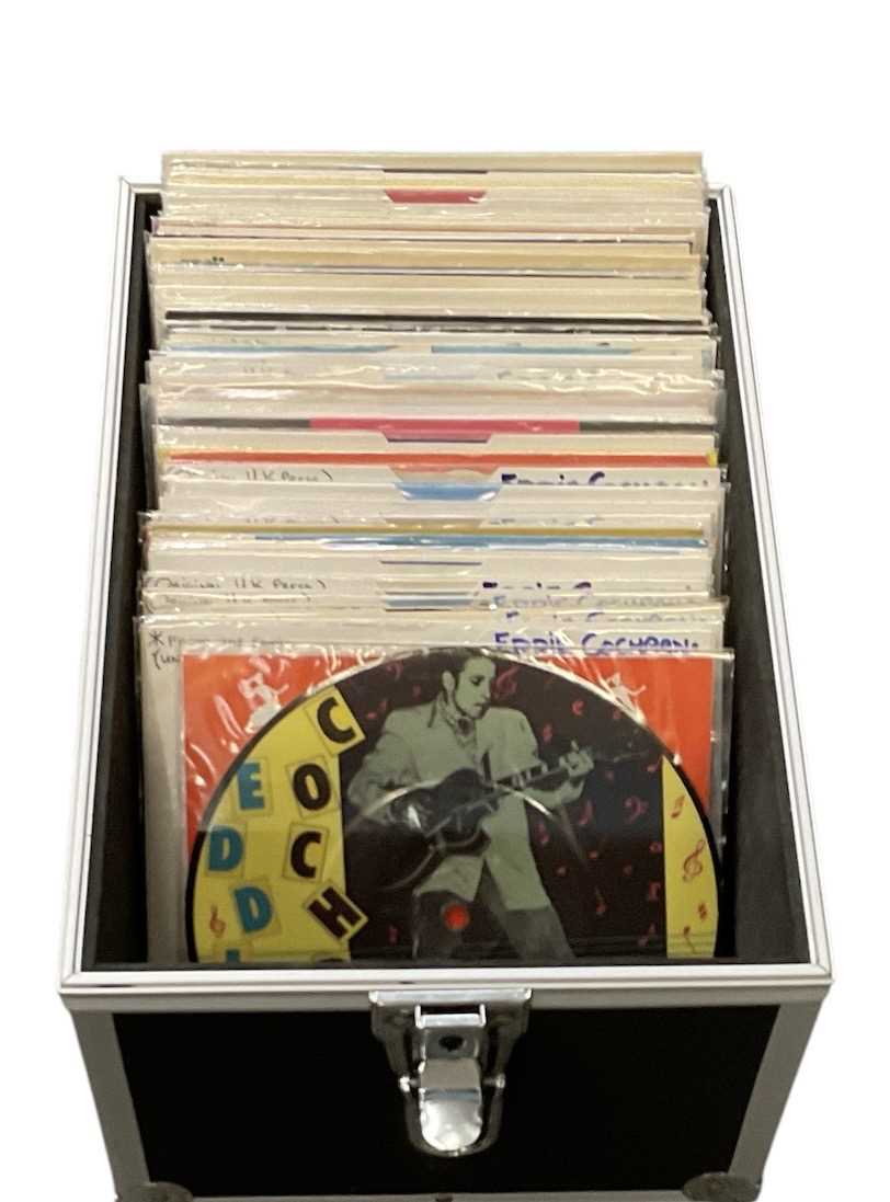 Lot 394 - EDDIE COCHRAN; a case of 45rpm records...
