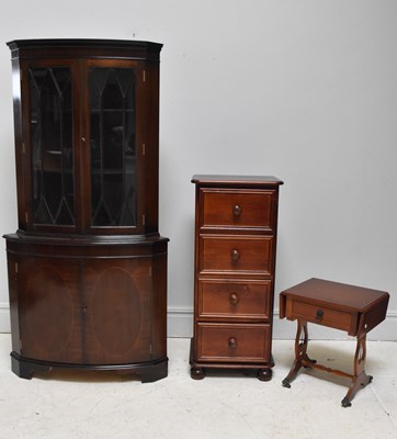 Lot 1057 - A reproduction bowfronted freestanding corner...