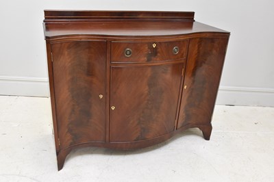 Lot 1058 - A reproduction mahogany serpentine fronted...