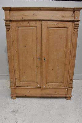 Lot 1029 - A Victorian pine armoire with a pair of...