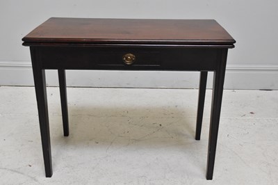 Lot 1156 - A 19th century mahogany fold-over tea table on...