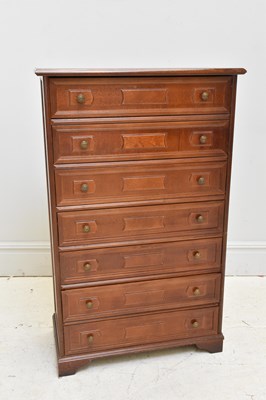 Lot 1052 - A modern pillar type chest of seven drawers,...