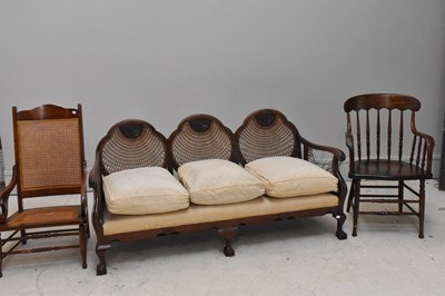 Lot 1157 - An early 20th century bergère three seater...