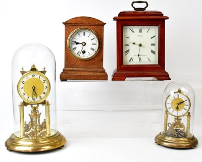 Lot 139 - Two brass anniversary clocks under glass domes,...