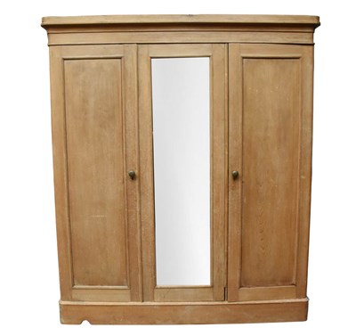 Lot 1084 - A Victorian pine three door wardrobe with...