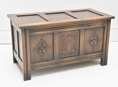Lot 1060 - A reproduction oak coffer, width 91cm.