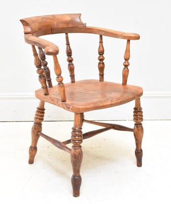 Lot 1125 - A 19th century elm seated smoker's bow back...