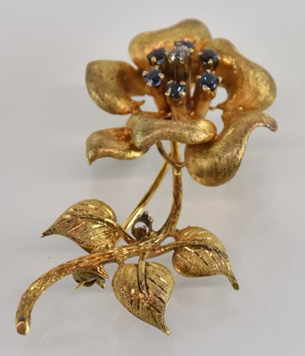 Lot 1477 - A yellow metal sapphire and diamond set brooch...