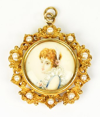 Lot 840 - An Edwardian yellow metal pendant brooch set...