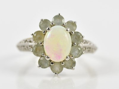 Lot 487 - A 9ct white gold cluster ring, size M 1/2, by...