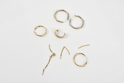 Lot 198 - A pair of yellow metal loop earrings and...
