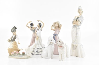 Lot 1619 - LLADRO; lady with dog and parisol, dancing...