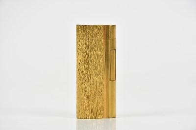 Lot 1375 - DUNHILL; a gold plated textured cigarette...