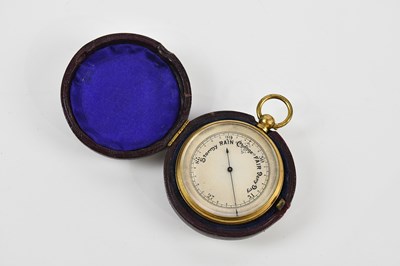 Lot 1447 - A brass plated pocket barometer with silvered...