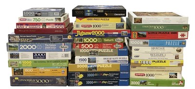 Lot 523 - A collection of approximately thirty jigsaw...