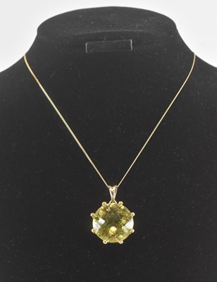 Lot 1427 - A 9ct yellow gold citrine mounted pendant,...