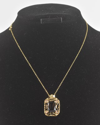 Lot 1428 - A yellow metal mounted smoky quartz set...