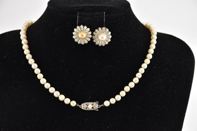 Lot 1438 - MIKIMOTO; a single strand white metal mounted...