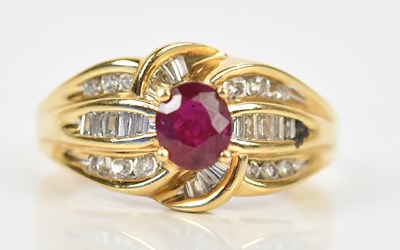 Lot 354 - A yellow metal diamond and ruby set dress ring,...