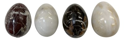 Lot 322 - Four carved hardstone eggs including...