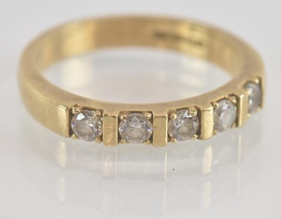 Lot 1257 - A 9ct yellow gold white stone set five stone...