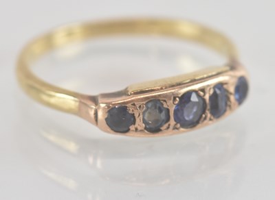 Lot 1267 - A yellow metal sapphire five stone ring, the...