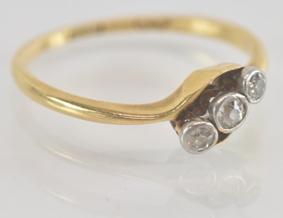 Lot 1259 - An 18ct yellow gold diamond three stone...