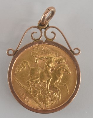 Lot 1618 - A George V half sovereign, 1911, in a 9ct gold...