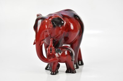 Lot 1587 - ROYAL DOULTON; a large flambé figure group...