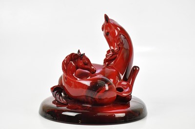 Lot 1602 - ROYAL DOULTON; a large flambé figure group...