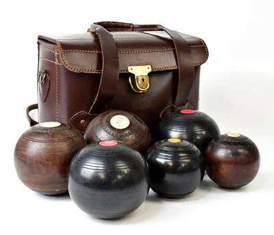 Lot 627 - Three lignum vitae bowling balls and three...