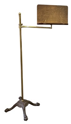 Lot 23 - An early 20th century cast iron brass and oak...