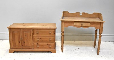 Lot 1034 - A pine television/media stand, with two...